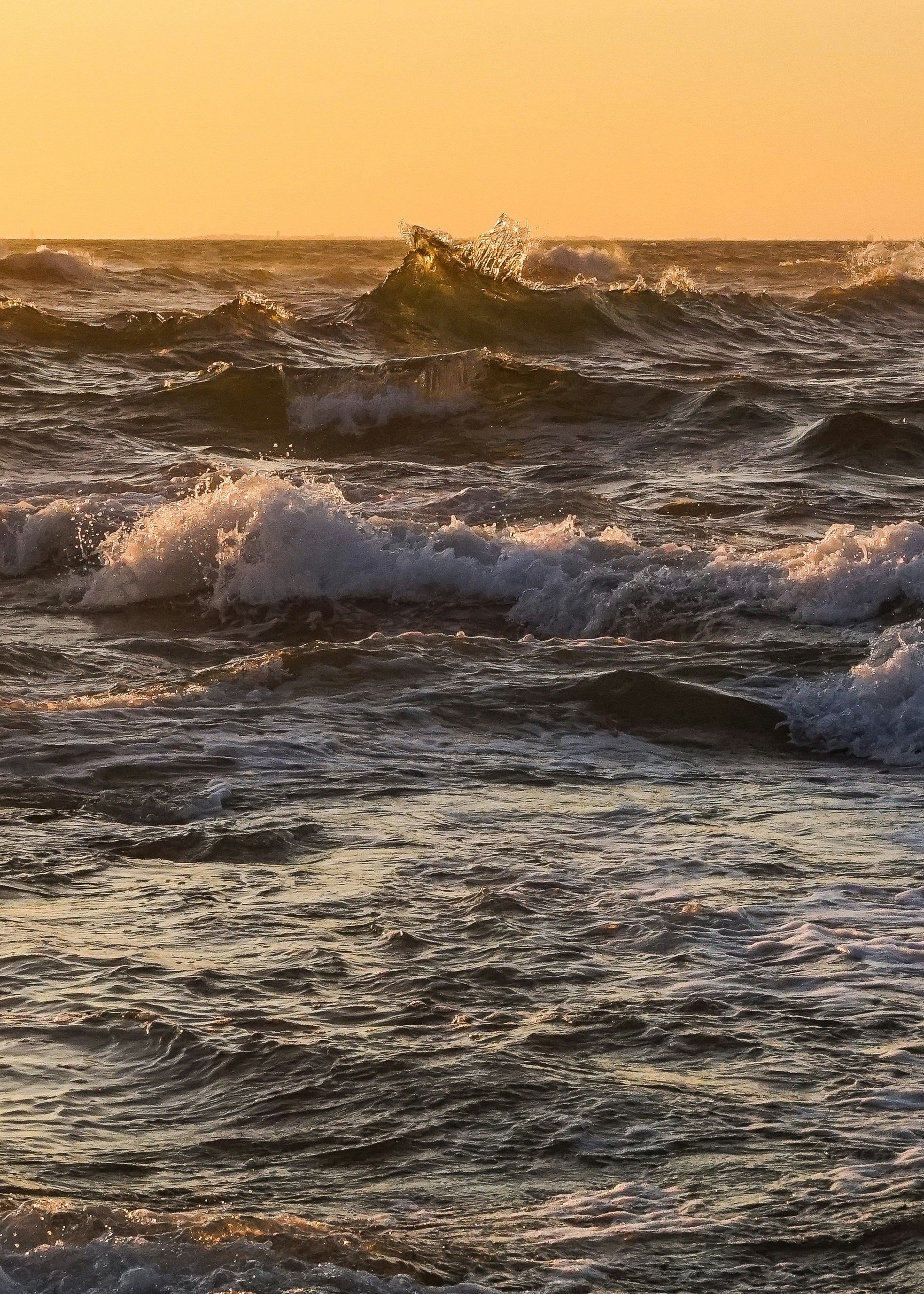 a person riding a surfboard on a wave in the ocean