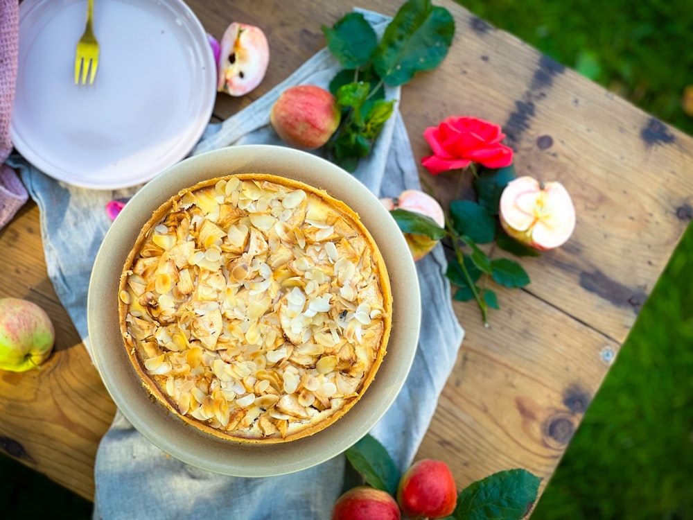 a bowl of food sitting on top of a wooden table