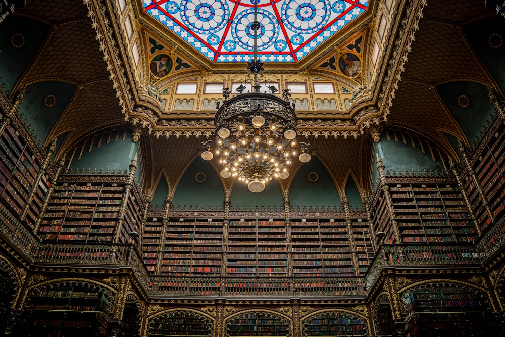 a chandelier hanging from the ceiling of a library