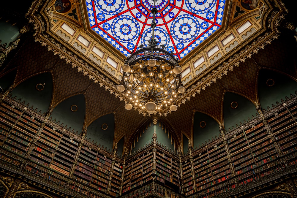 a chandelier hanging from the ceiling of a library
