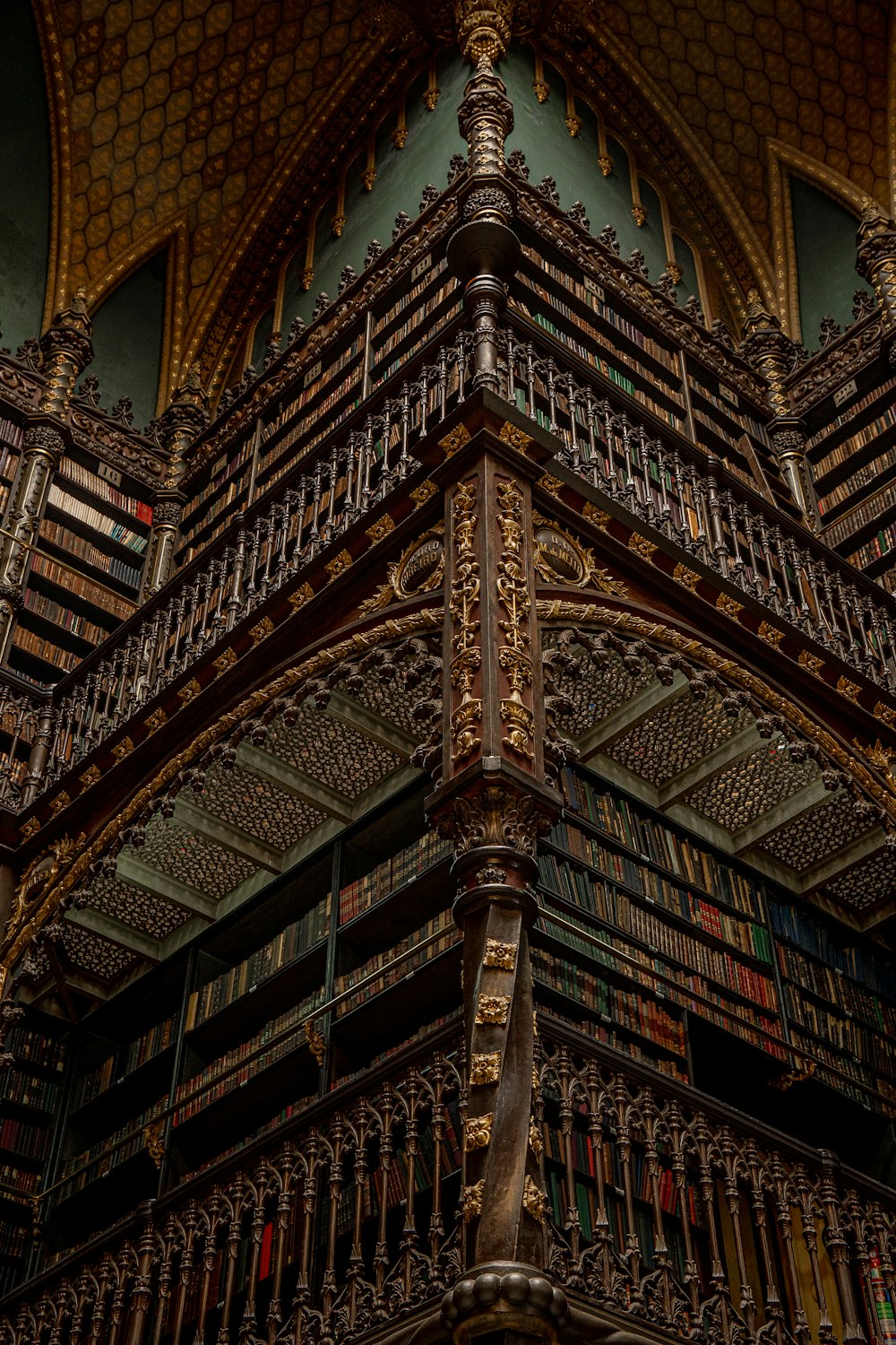 a tall wooden structure with lots of books on it