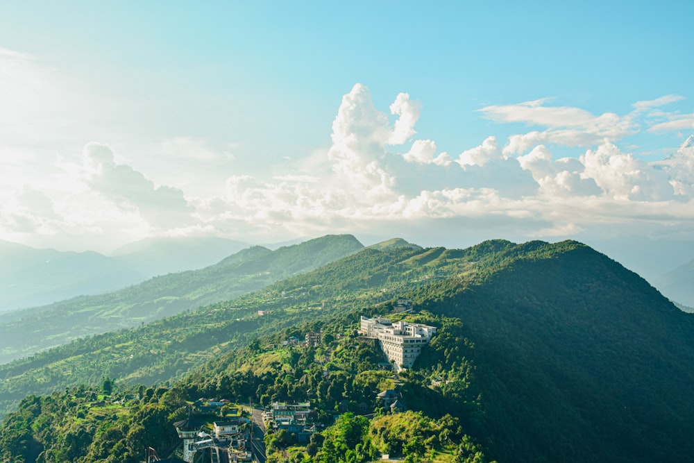 a scenic view of a town on a mountain