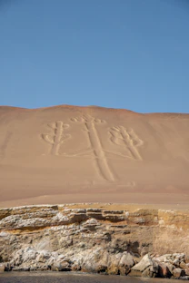a sign that is on the side of a hill