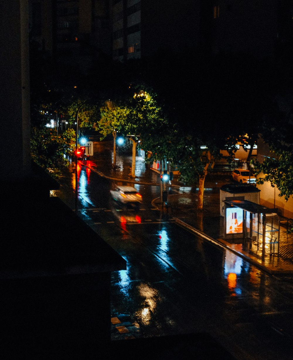 a city street at night in the rain