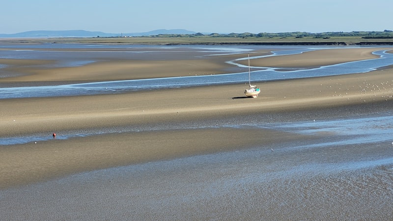 Small boat on the estuary at Laugharne, Wales