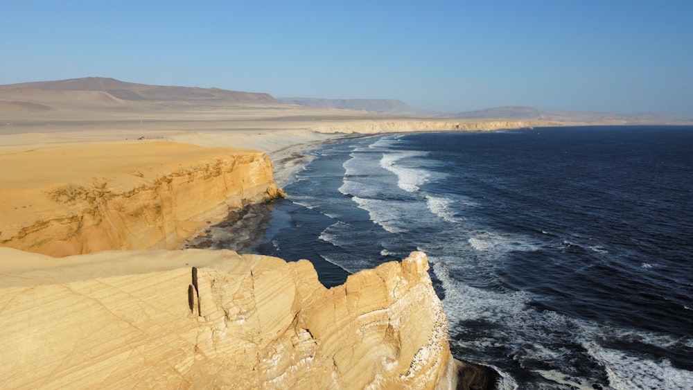 a view of the ocean from the top of a cliff