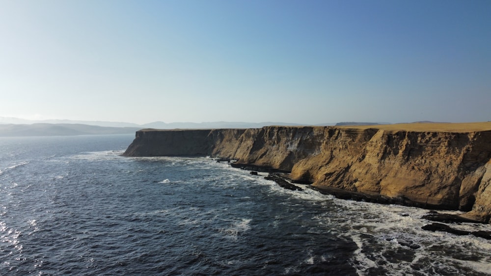 a cliff that is next to the ocean