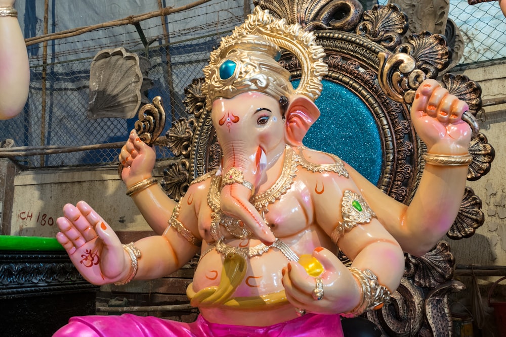 a statue of an elephant with a crown on it's head