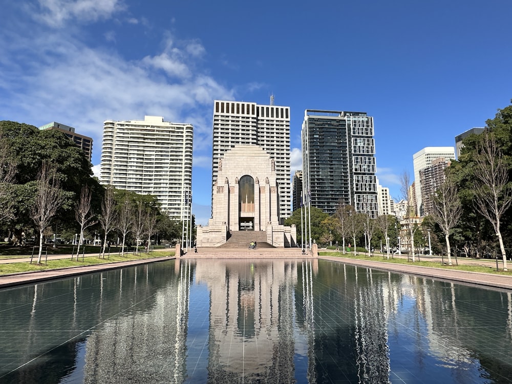 a large body of water surrounded by tall buildings