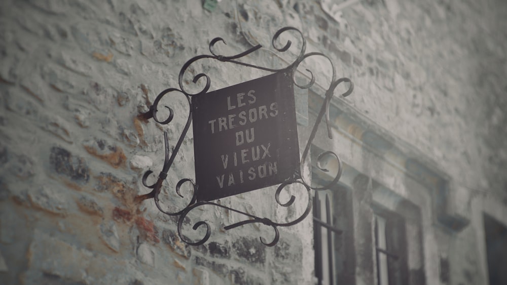 a sign on the side of a brick building