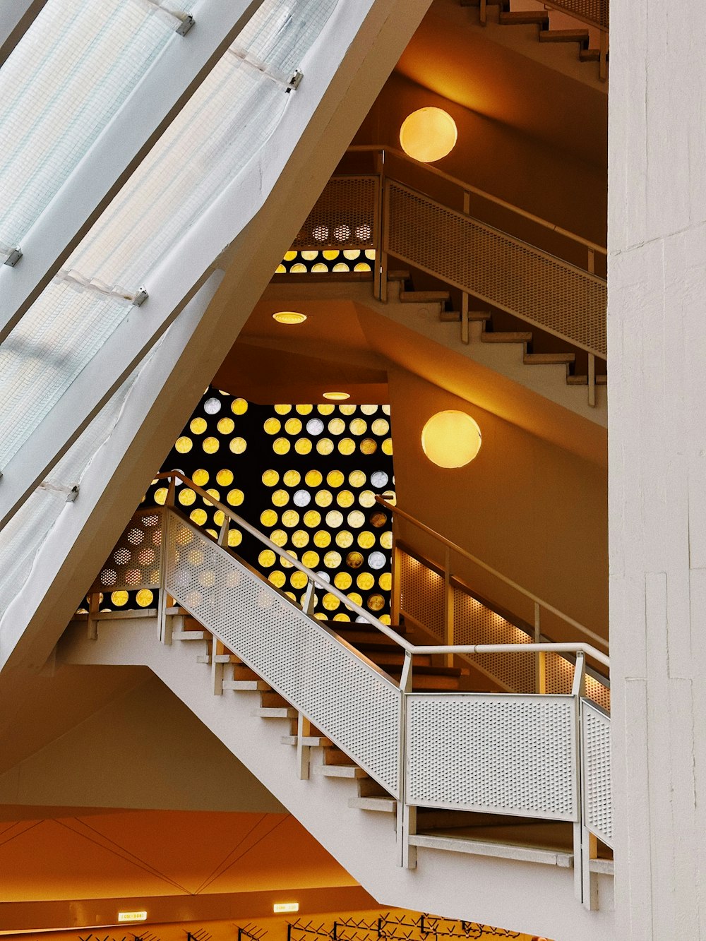 a large building with a bunch of lights hanging from it's ceiling