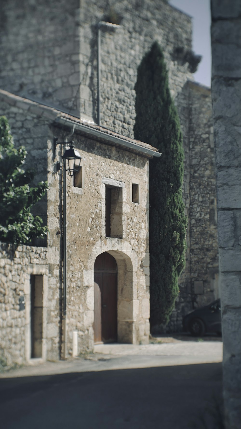 a stone building with a clock on the front of it