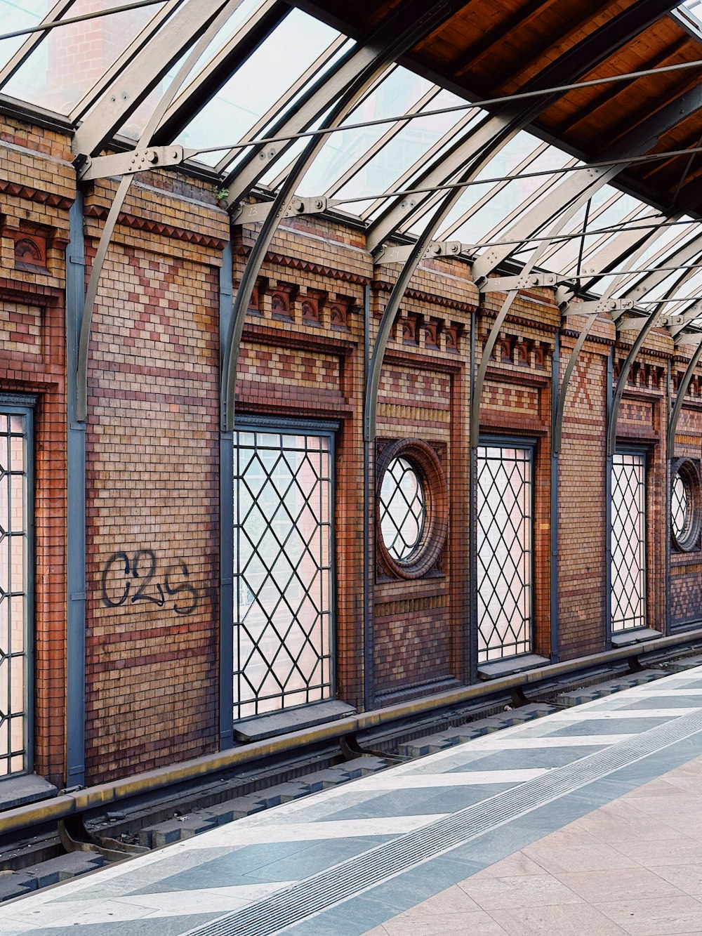 a train station with a train on the tracks