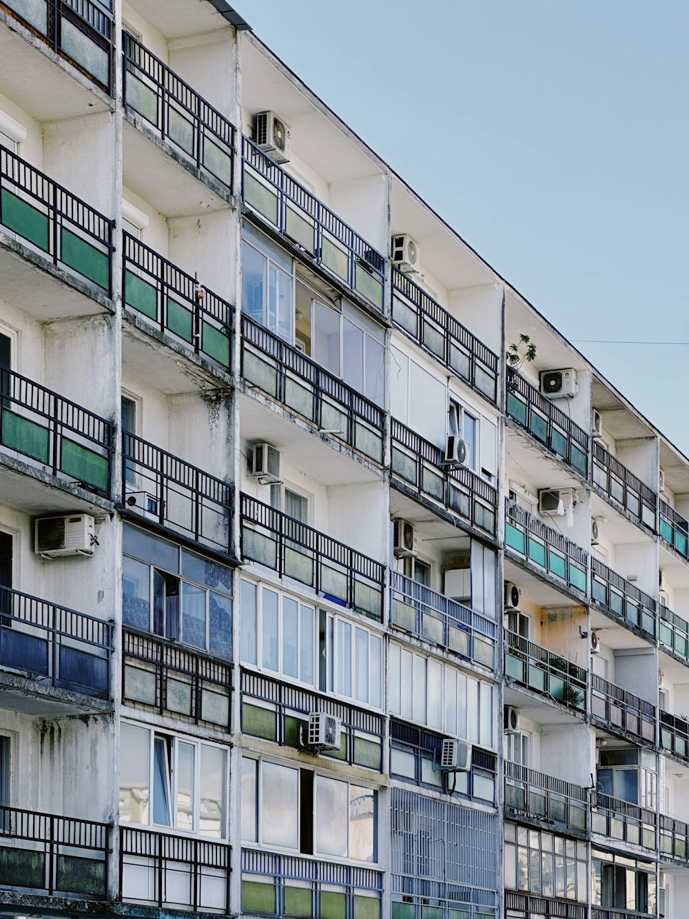 an apartment building with balconies and balconies on the balconies