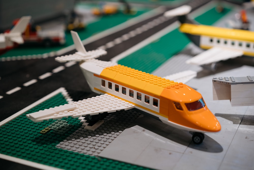a lego model of a passenger jet on a runway
