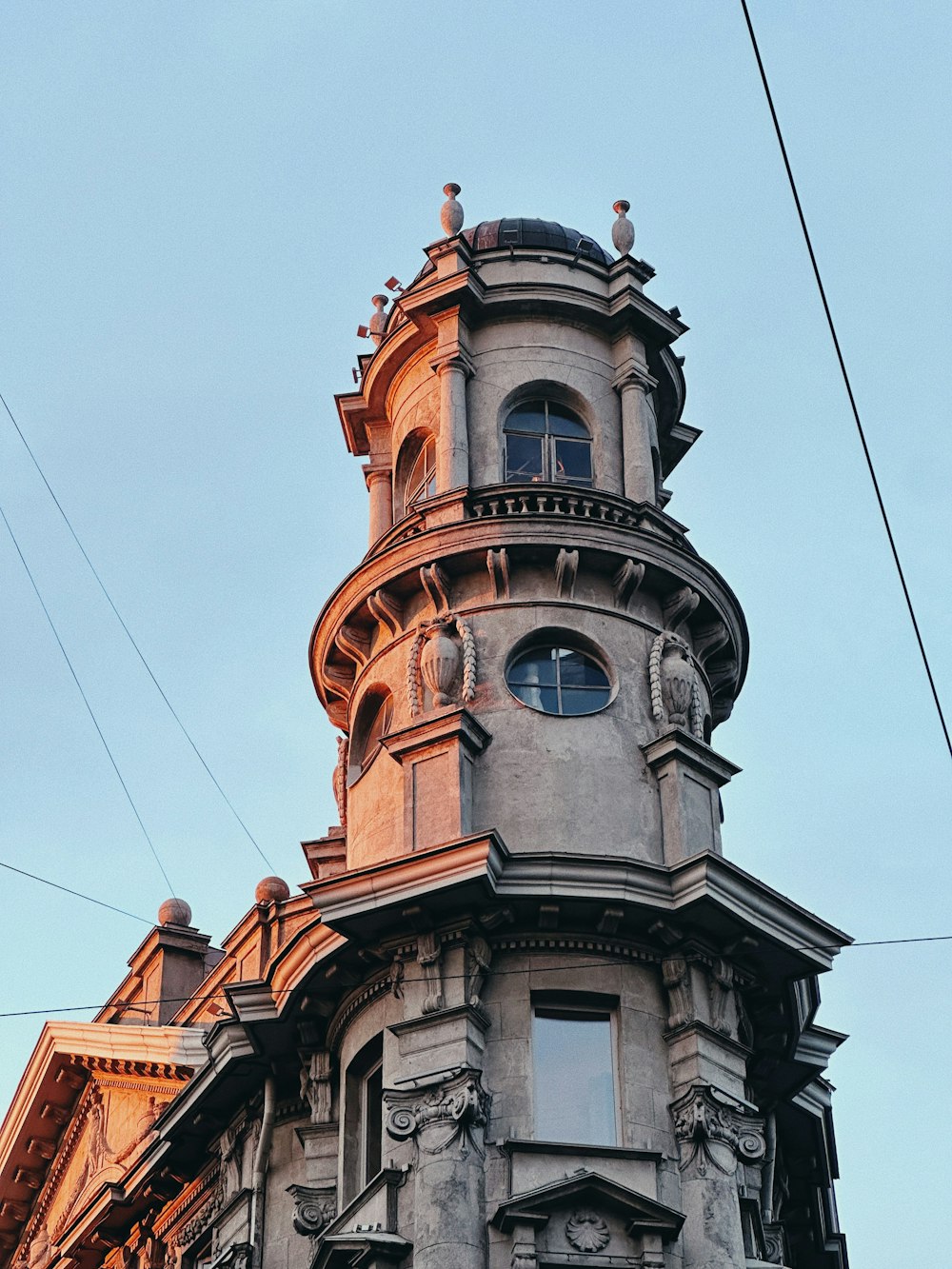 a tall building with a clock on the top of it