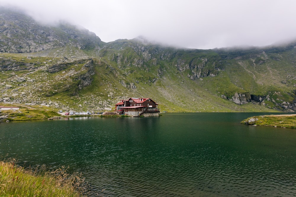 a house on a small island in the middle of a lake