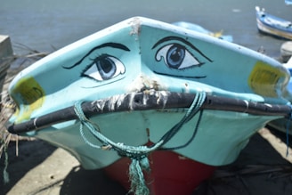 A rugged bilge baboon mascot leaning on a boat engine, smirking with a wrench in hand.