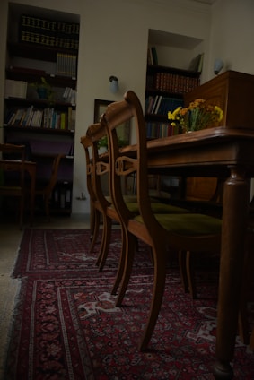 Photo of a warm, inviting law office with shelves of legal books and a friendly lawyer consulting a client.