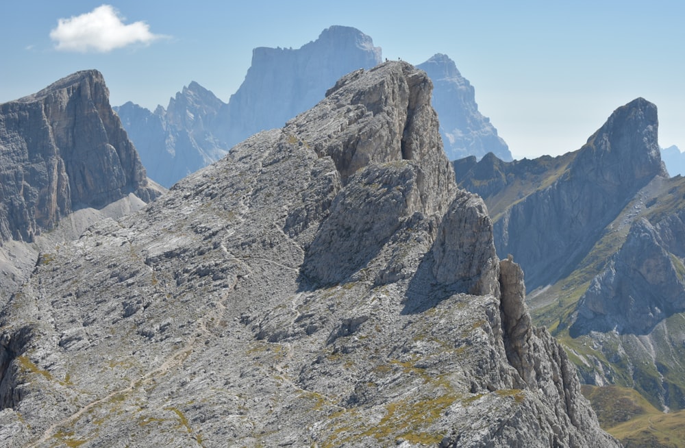 a group of mountains with a sky background