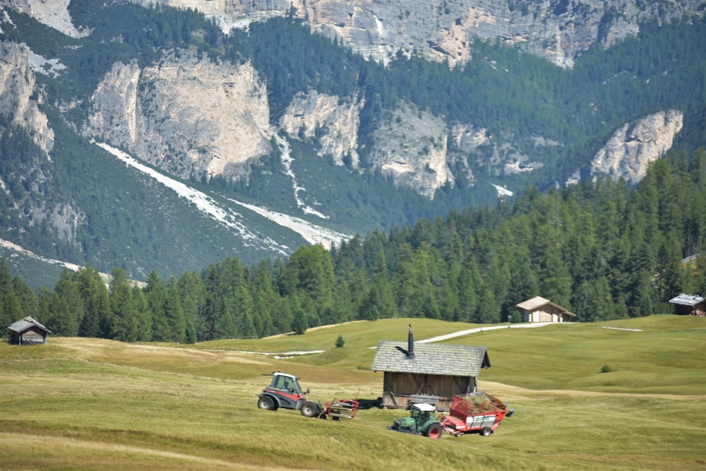 a couple of trucks are parked in a field