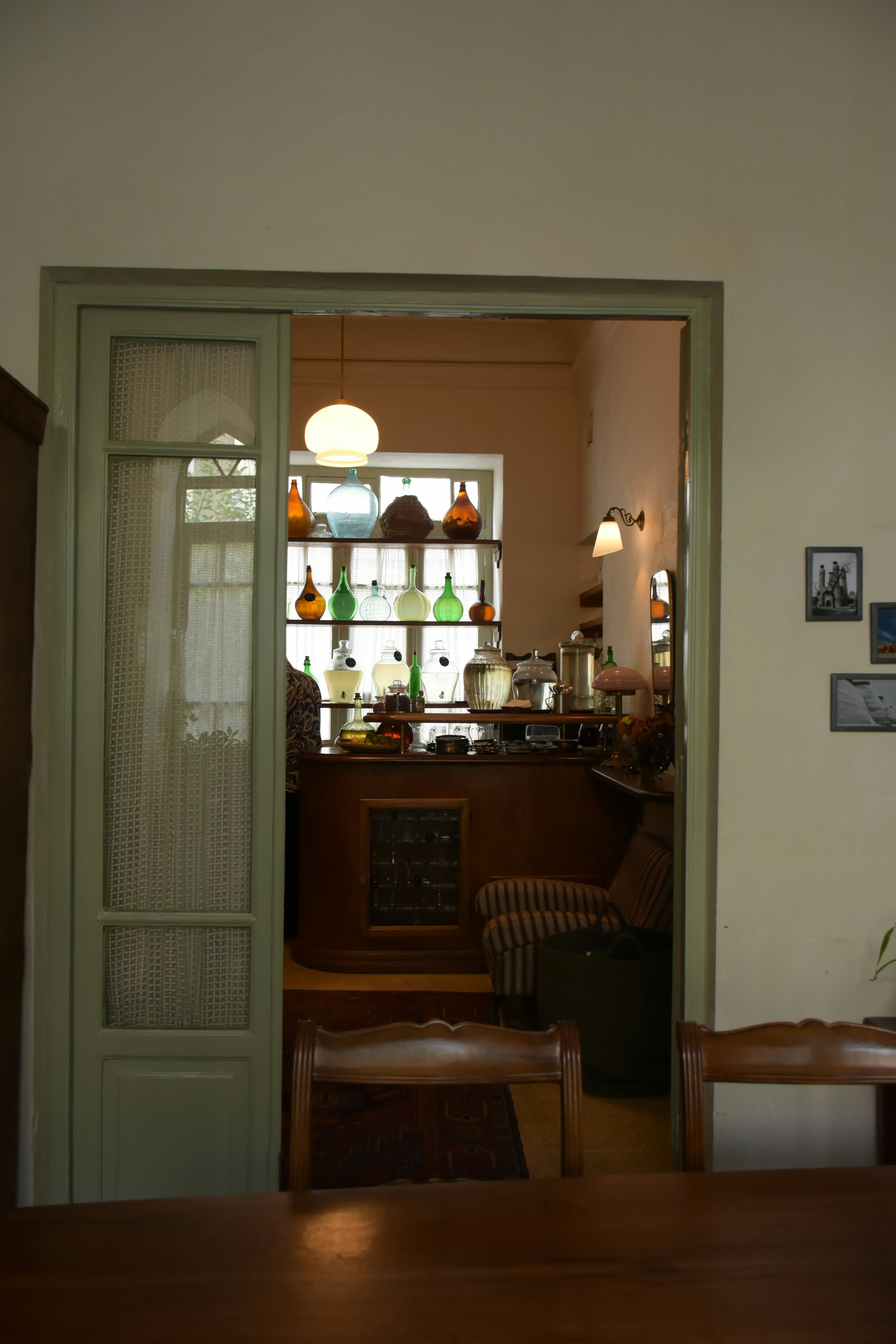 an open door leading to a kitchen and dining room