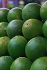 a pile of limes sitting on top of each other