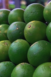 a pile of limes sitting on top of each other