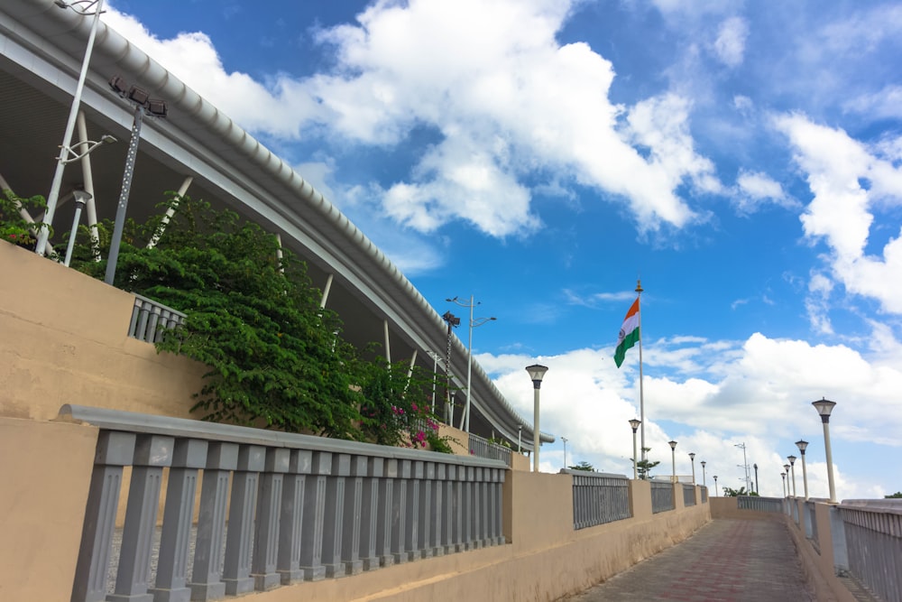 a building with a fence and a flag on top of it