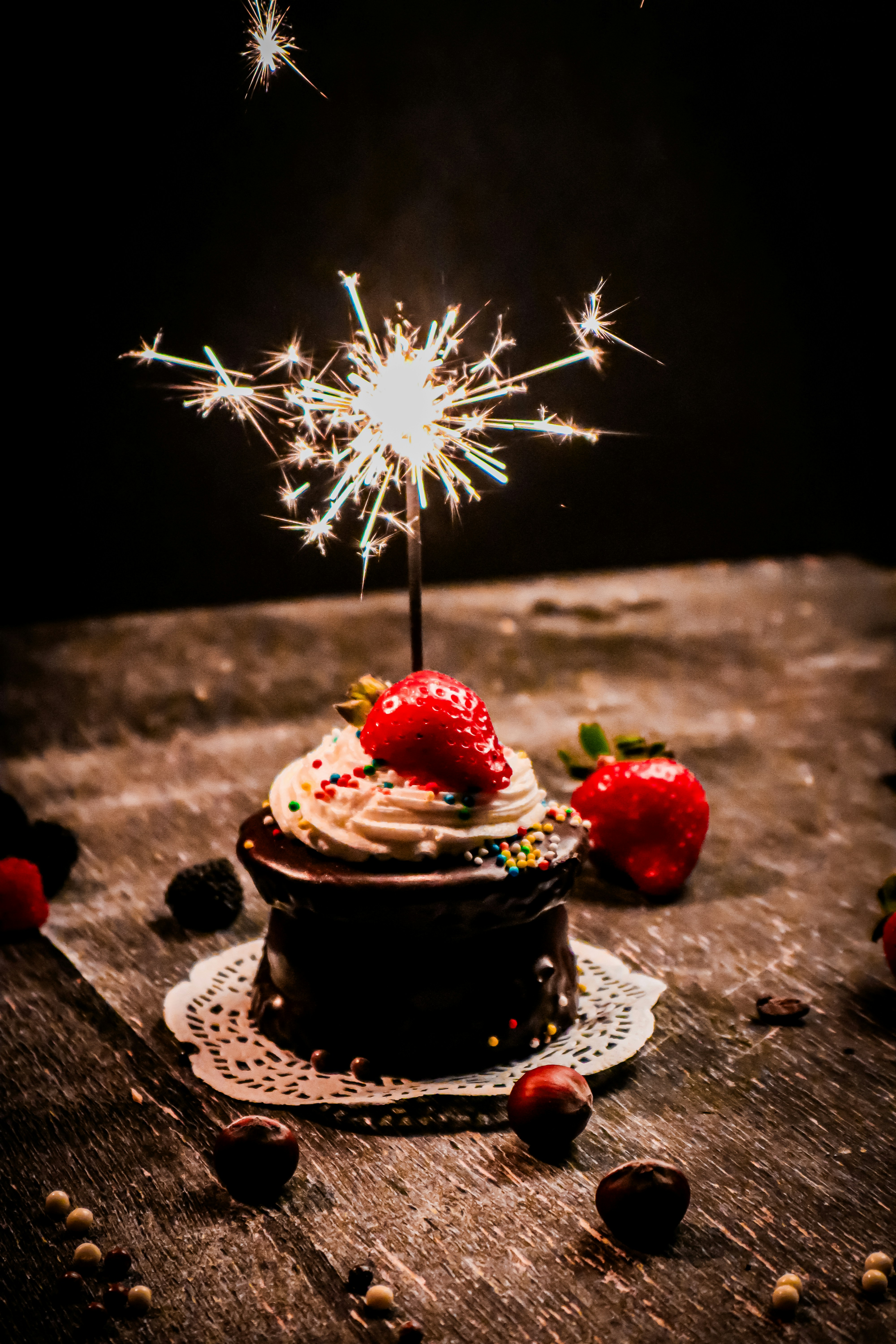 a cupcake with a sparkler on top of it