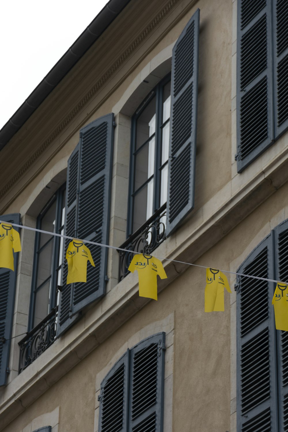 clothes hanging on a clothes line in front of a building