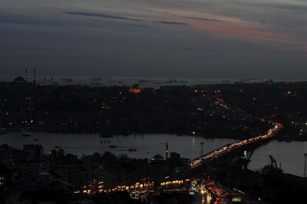 a night time view of a city and a river