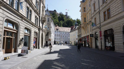 Historic European city street with charming architecture and cobblestones.