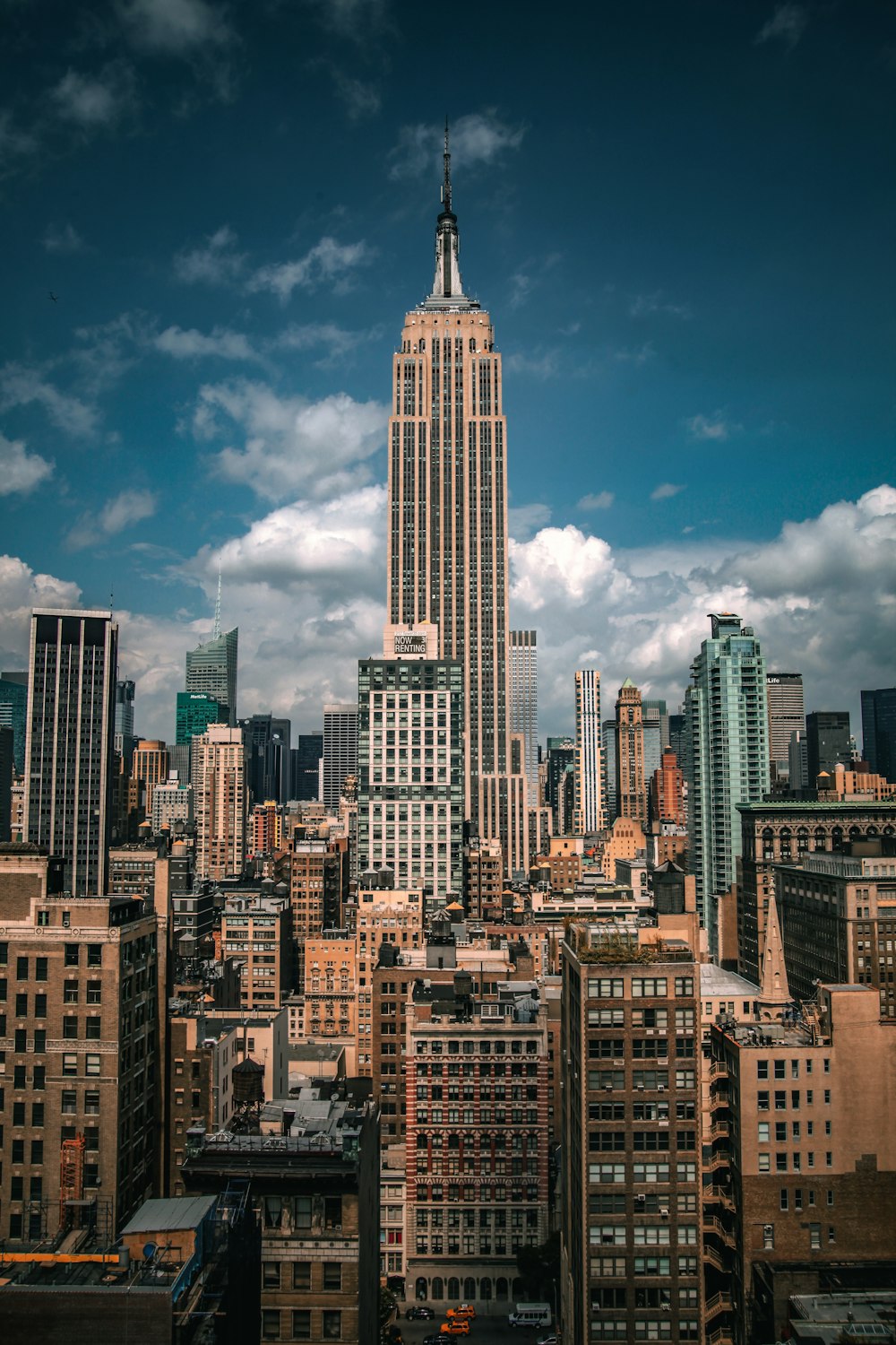 a very tall building towering over a city