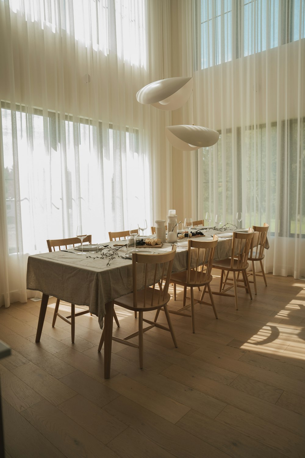 a dining room with a table and chairs