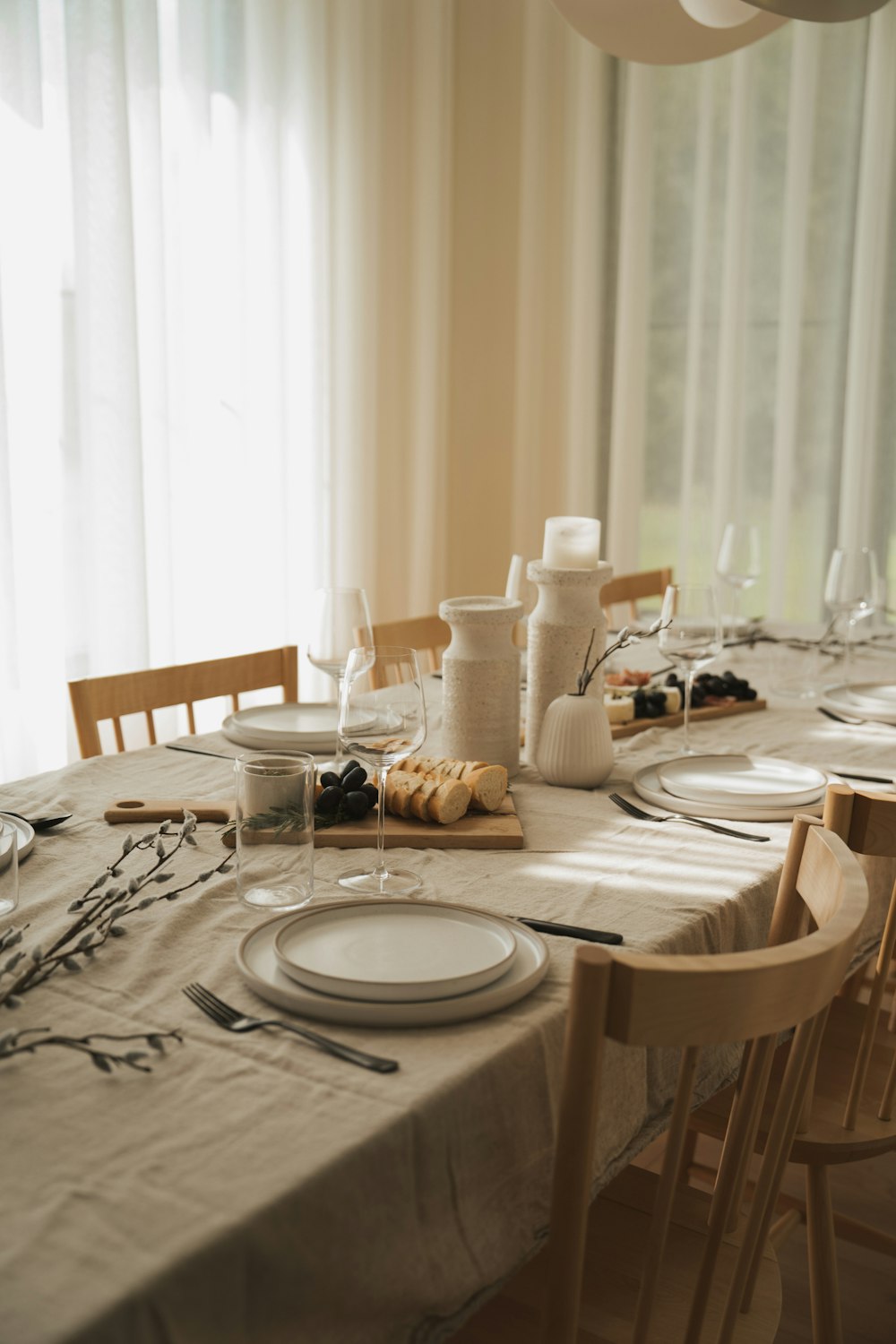 a dining table with plates and utensils on it