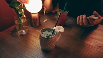 A serene morning scene with a soft lavender glow illuminating a journal, a cup of herbal tea, and a smartphone displaying the gluta.ai app interface.