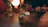 A cozy setting with a person holding a phone, smiling gently.