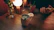 A cozy setting with a person holding a phone, smiling gently.