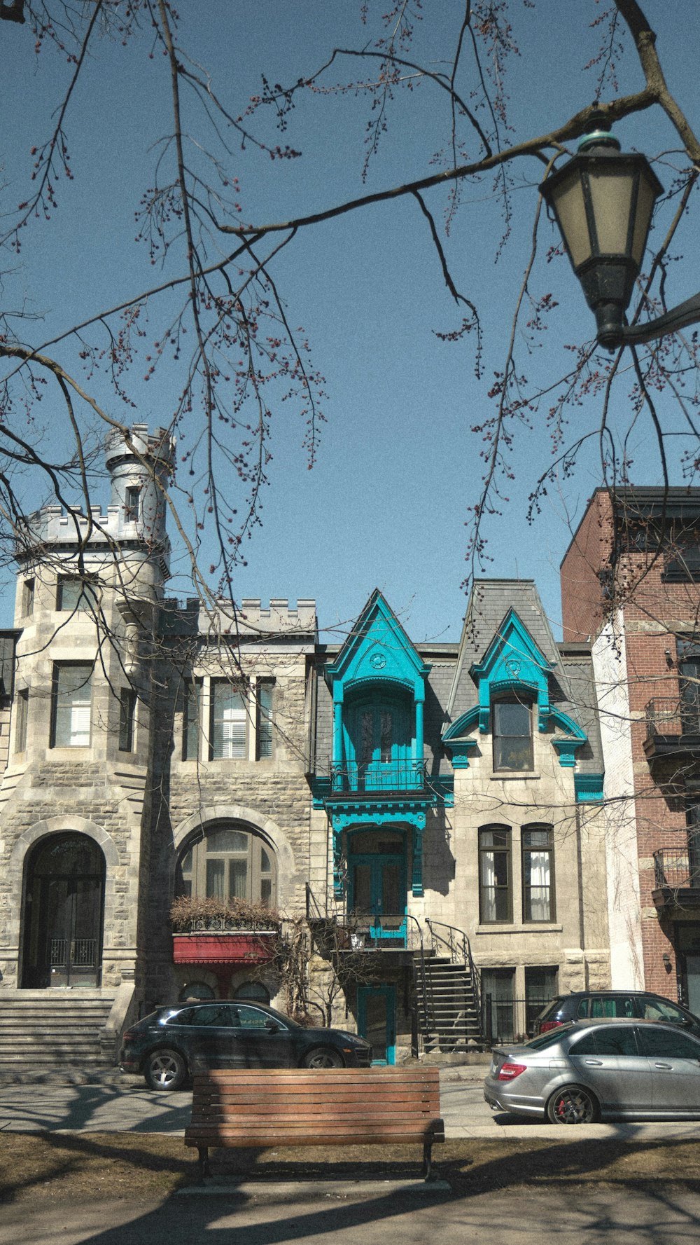 a bench sitting in front of a tall building