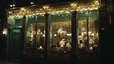 An inviting shot of the cozy interior of Questo Caffè with warm lighting and rustic Italian decor.