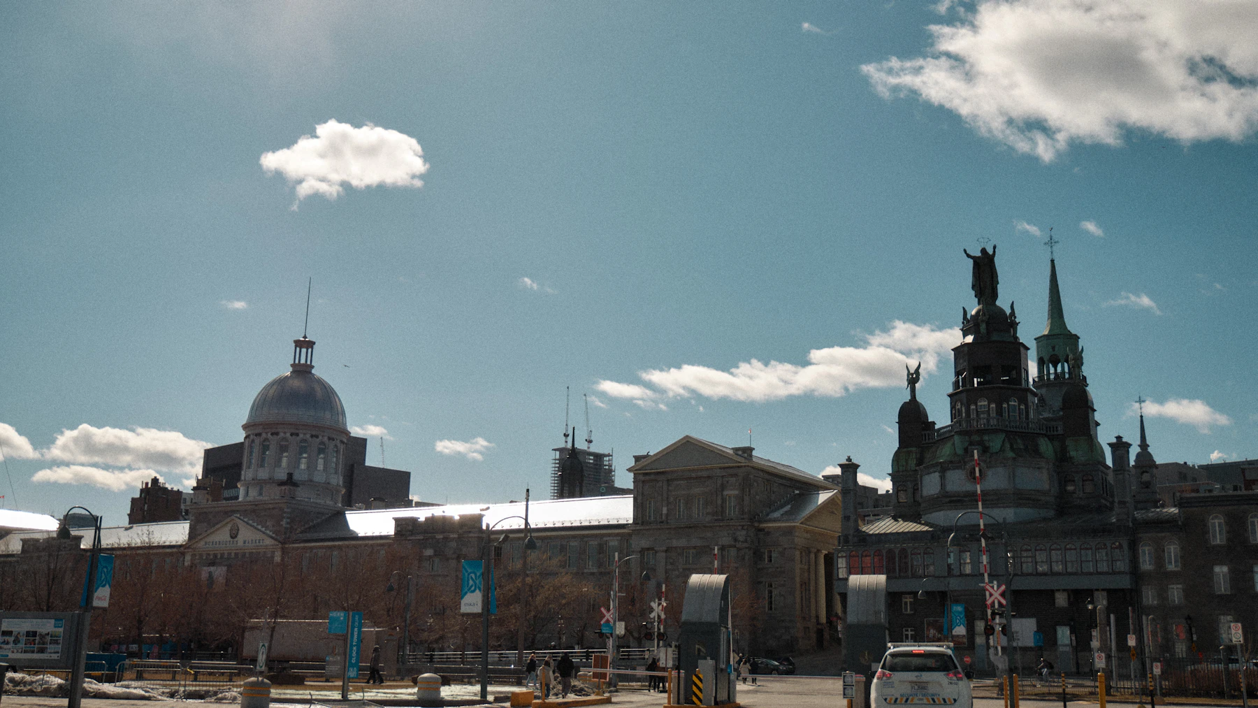 A large historic building rises against a clear sky in Québec City.