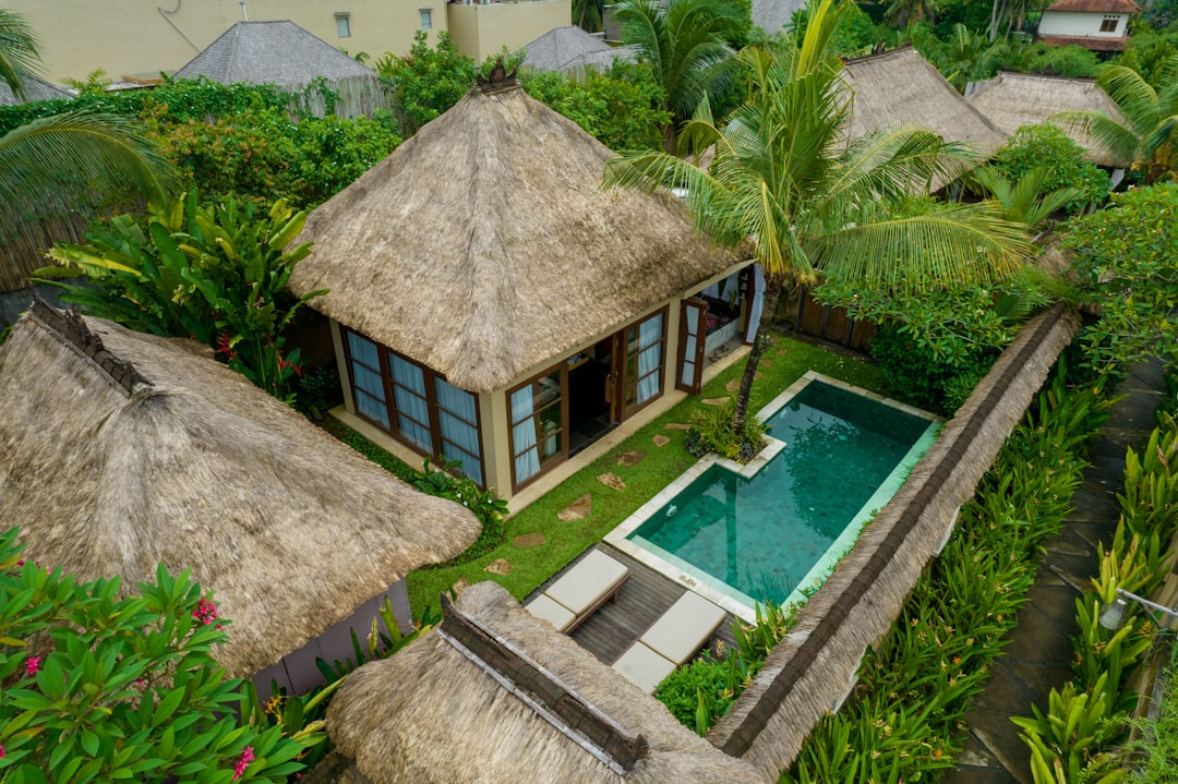 an aerial view of a tropical resort with a pool,