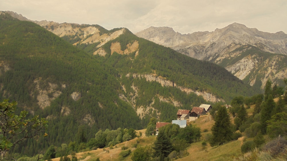 a house in the middle of a mountain range