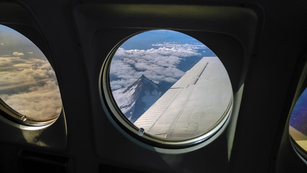 a view of the wing of an airplane through a window