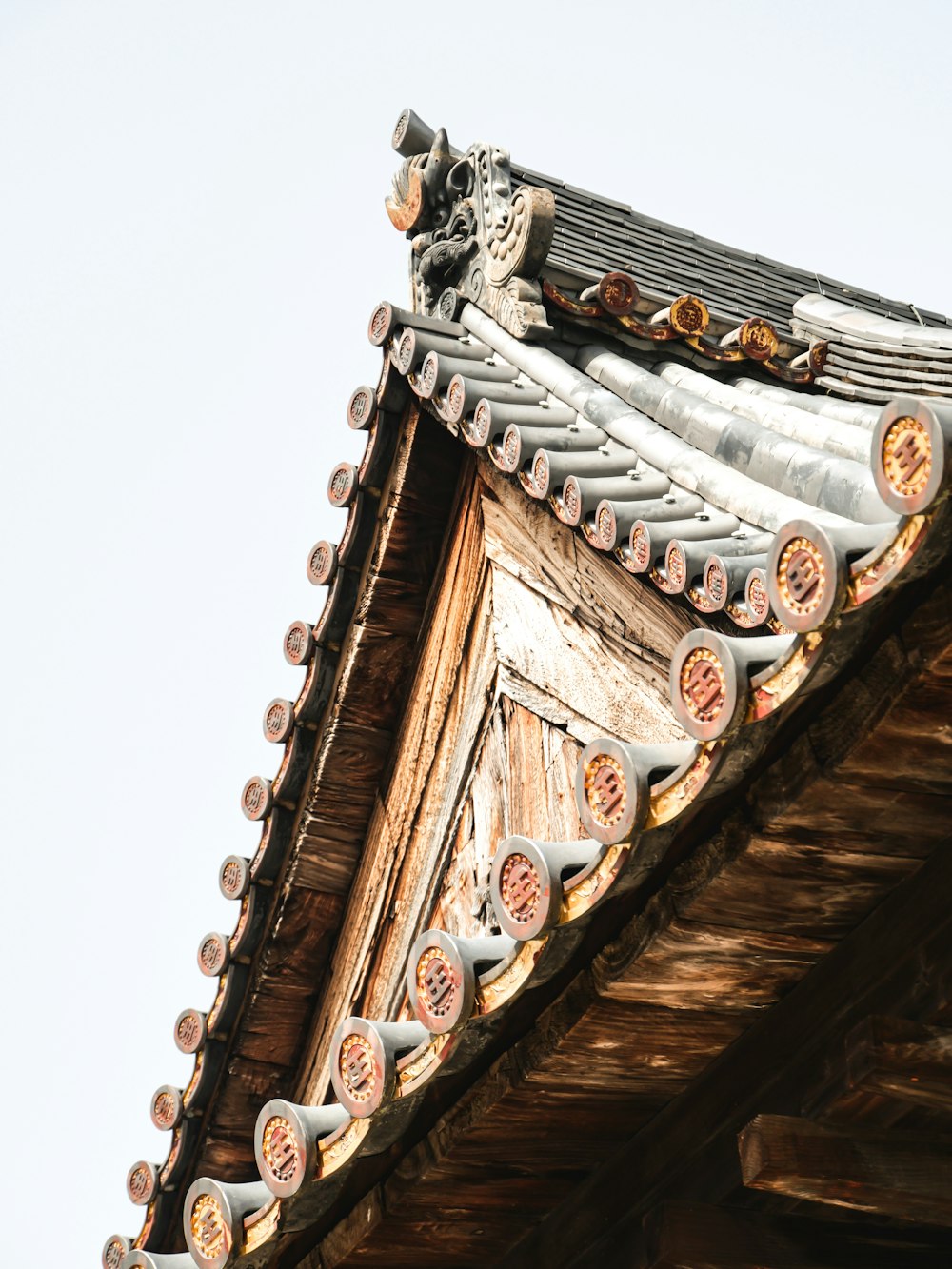 a close up of a roof with a sky background