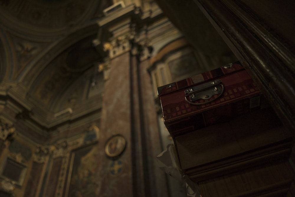 a red box sitting in the middle of a room