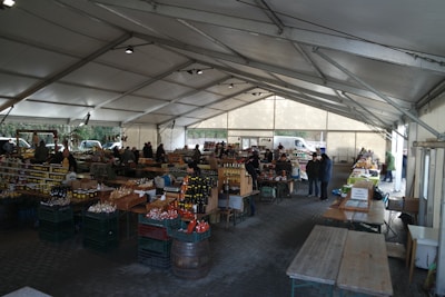 A vibrant market scene with local farmers selling fresh vegetables and homemade preserves.