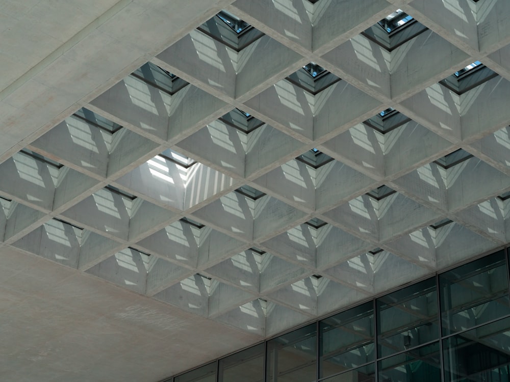 a building with a ceiling that has many windows