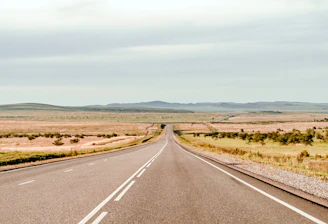 an empty road in the middle of nowhere